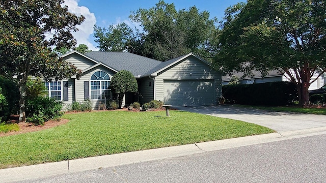 single story home featuring an attached garage, concrete driveway, a front lawn, and a shingled roof