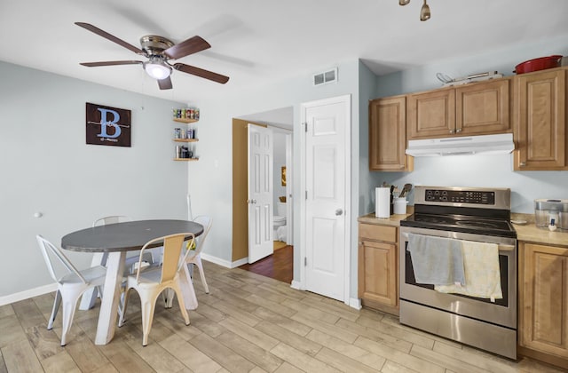 4662 Nibbs Ln, North Charleston, SC 29418 - kitchen with stainless steel electric range oven, under cabinet range hood, ceiling fan, light wood-type flooring, and light countertops