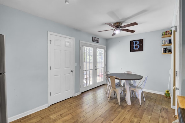 4662 Nibbs Ln, North Charleston, SC 29418 - dining space with french doors, a ceiling fan, baseboards, and light wood-style flooring