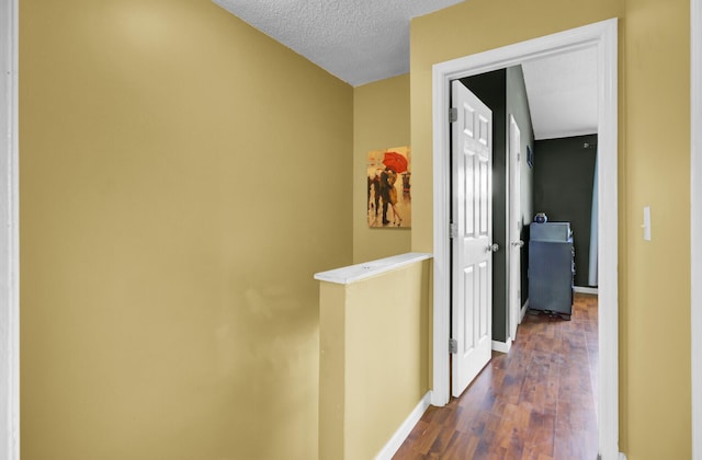 4662 Nibbs Ln, North Charleston, SC 29418 - hall with dark wood-style flooring, an upstairs landing, baseboards, and a textured ceiling