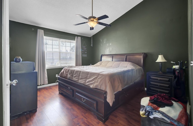 4662 Nibbs Ln, North Charleston, SC 29418 - bedroom with lofted ceiling, dark wood-style flooring, ceiling fan, and a textured ceiling