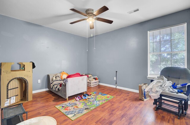 4662 Nibbs Ln, North Charleston, SC 29418 - bedroom with wood finished floors, baseboards, and a ceiling fan