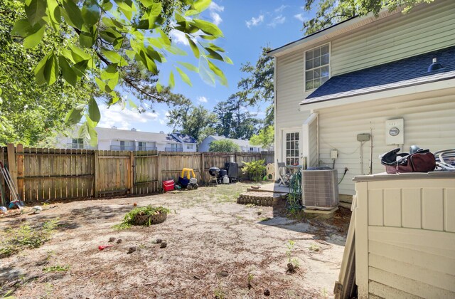 4662 Nibbs Ln, North Charleston, SC 29418 - fenced backyard with cooling unit and a patio area