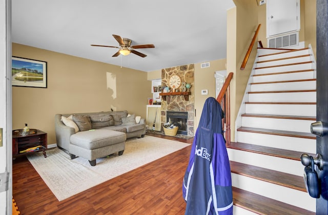 4662 Nibbs Ln, North Charleston, SC 29418 - living area with a ceiling fan, stairs, wood finished floors, and a stone fireplace