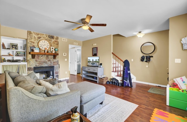 4662 Nibbs Ln, North Charleston, SC 29418 - living area featuring ceiling fan, stairs, a fireplace, wood finished floors, and baseboards