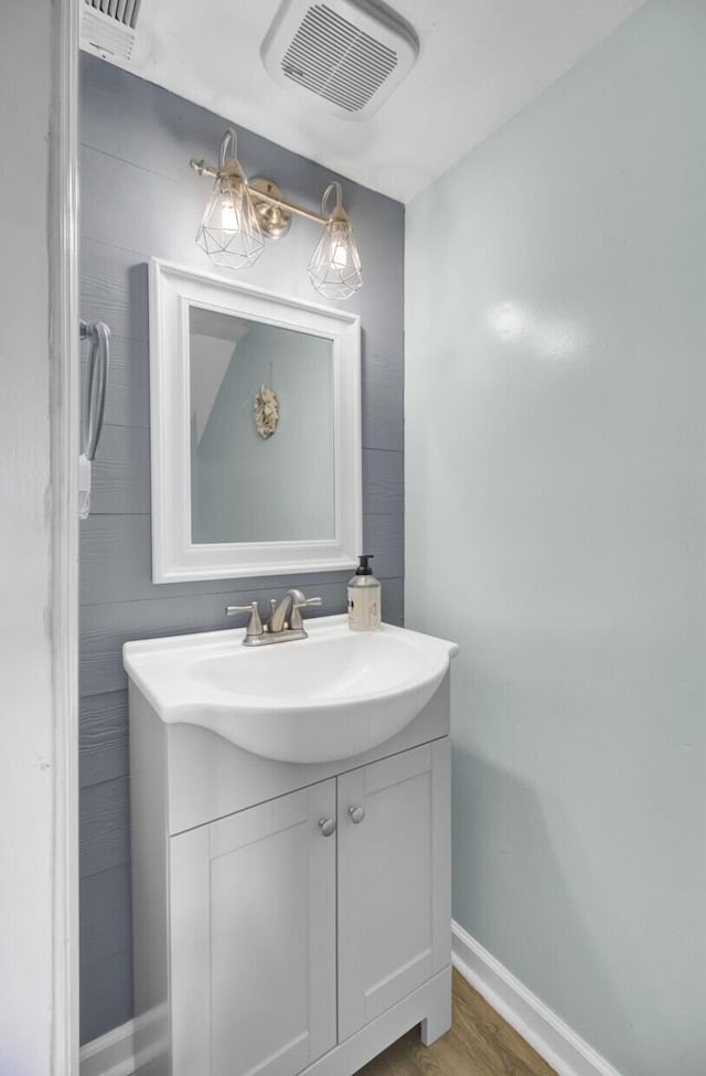 4662 Nibbs Ln, North Charleston, SC 29418 - bathroom featuring vanity, baseboards, and wood finished floors
