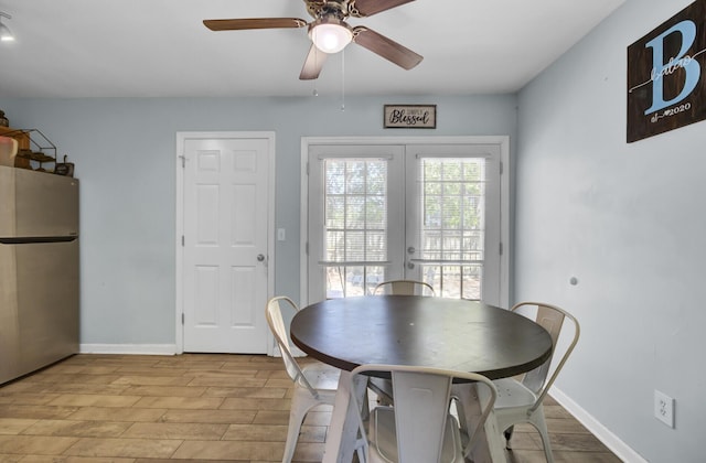 4662 Nibbs Ln, North Charleston, SC 29418 - dining space featuring light wood-style flooring, ceiling fan, french doors, and baseboards