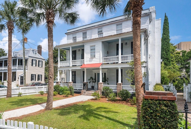 view of front of home with covered porch and a balcony