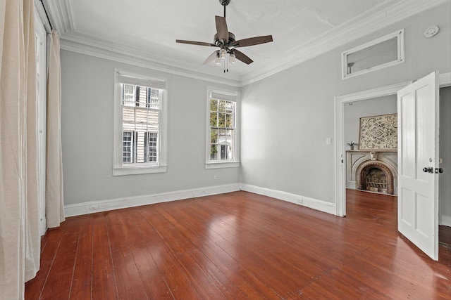 interior space with a fireplace, ceiling fan, dark hardwood / wood-style floors, and crown molding