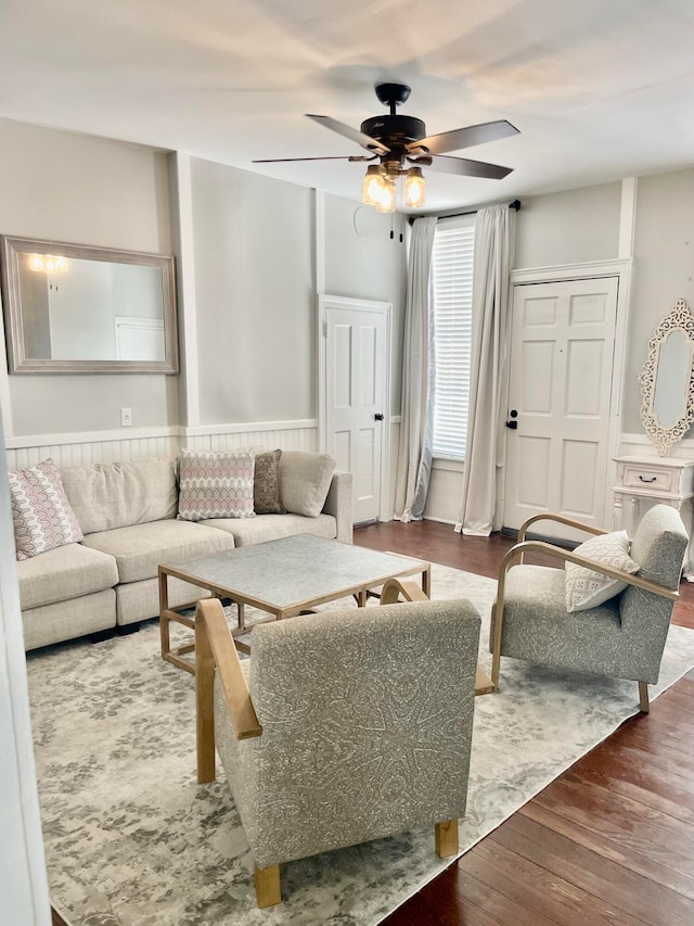 living room featuring hardwood / wood-style flooring and ceiling fan