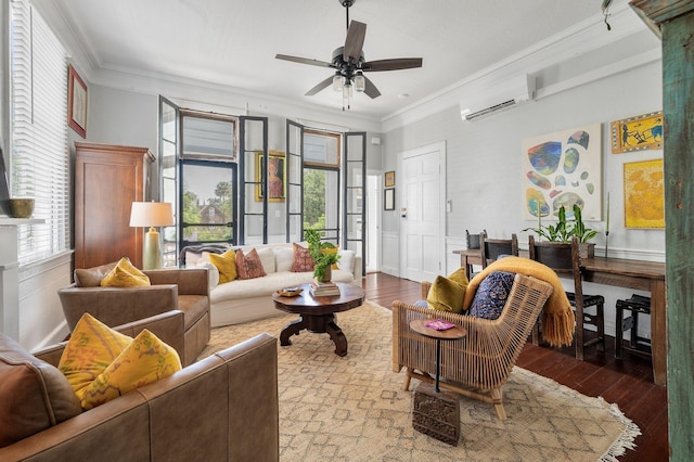 living room with wood-type flooring, crown molding, and plenty of natural light