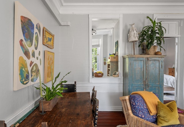 dining room with hardwood / wood-style flooring and ornamental molding