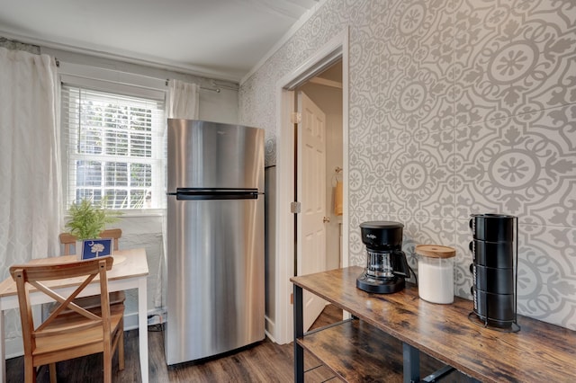 kitchen with butcher block countertops, stainless steel refrigerator, dark hardwood / wood-style floors, and crown molding