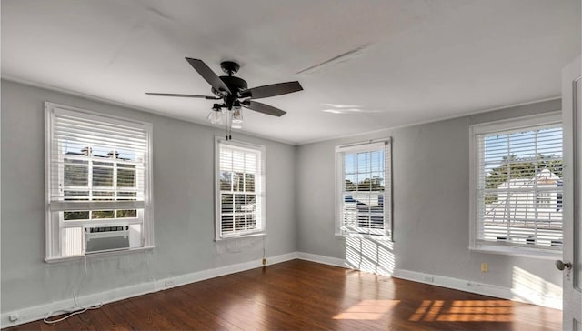 empty room with dark wood-type flooring, cooling unit, and ceiling fan