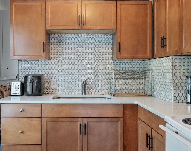 kitchen with tasteful backsplash and sink