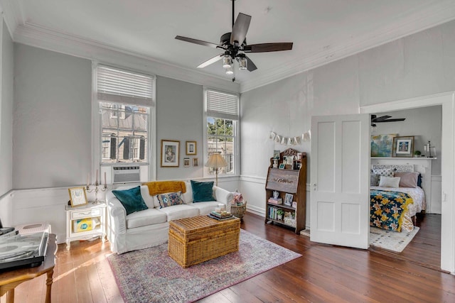 living room featuring cooling unit, dark hardwood / wood-style floors, crown molding, and ceiling fan