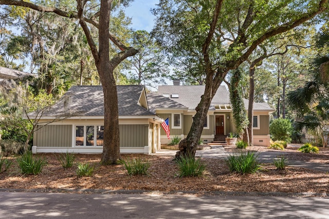 2105 Loblolly Ln, Seabrook Island, SC 29455 - view of front of house with roof with shingles, an attached garage, crawl space, and a chimney