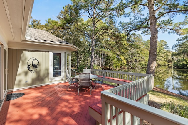 2105 Loblolly Ln, Seabrook Island, SC 29455 - wooden terrace with outdoor dining space, a water view, and view of scattered trees