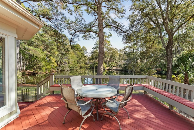 2105 Loblolly Ln, Seabrook Island, SC 29455 - wooden terrace featuring outdoor dining space and view of scattered trees