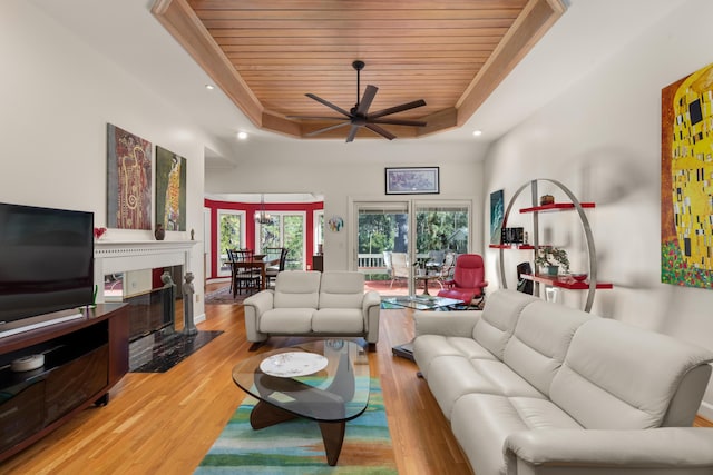 2105 Loblolly Ln, Seabrook Island, SC 29455 - living room featuring a raised ceiling, wood ceiling, a ceiling fan, light wood-type flooring, and recessed lighting