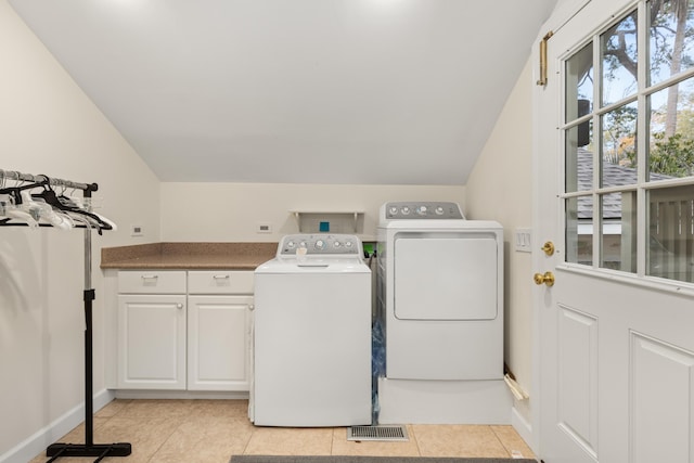 2105 Loblolly Ln, Seabrook Island, SC 29455 - laundry area featuring cabinet space, washing machine and dryer, light tile patterned floors, and baseboards