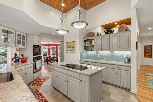2105 Loblolly Ln, Seabrook Island, SC 29455 - kitchen featuring black appliances, wooden ceiling, plenty of natural light, a kitchen island, and open shelves