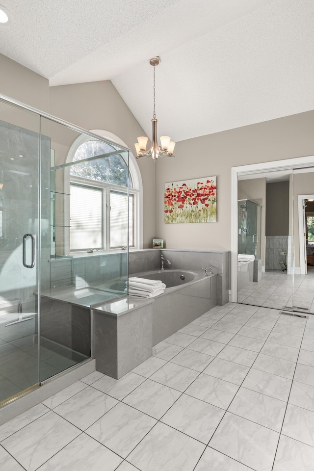 2105 Loblolly Ln, Seabrook Island, SC 29455 - full bath with a garden tub, lofted ceiling, plenty of natural light, a chandelier, and marble finish flooring
