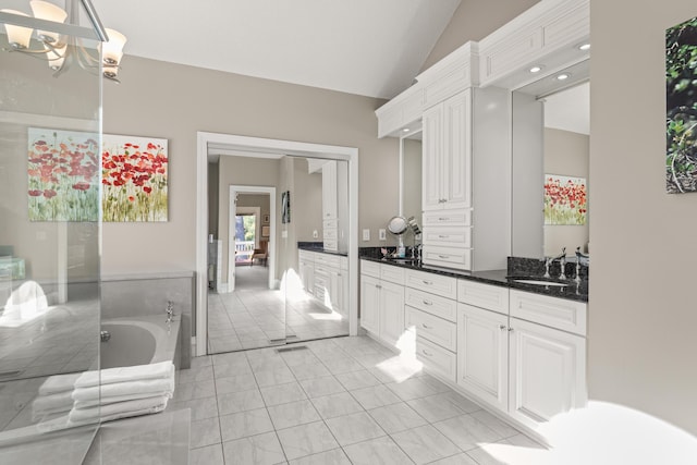 2105 Loblolly Ln, Seabrook Island, SC 29455 - bathroom featuring vanity, vaulted ceiling, a garden tub, and a chandelier