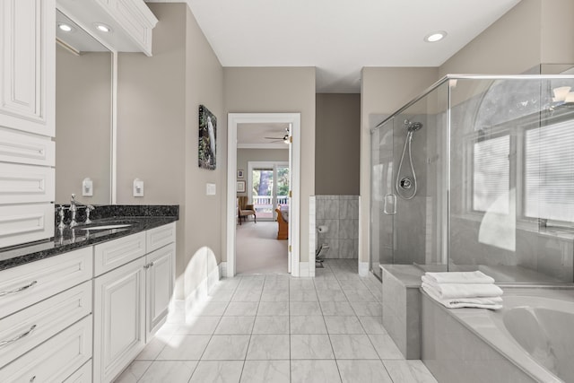 2105 Loblolly Ln, Seabrook Island, SC 29455 - bathroom featuring vanity, a bath, a stall shower, ensuite bath, and baseboards