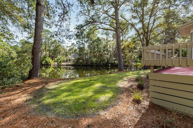 2105 Loblolly Ln, Seabrook Island, SC 29455 - view of green lawn with a deck with water view