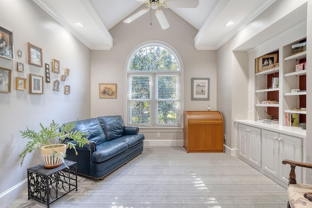 living area featuring ceiling fan, light colored carpet, built in features, and high vaulted ceiling