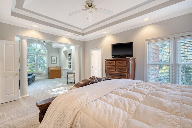 bedroom featuring a raised ceiling, ceiling fan, crown molding, and light colored carpet