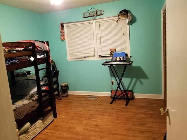 bedroom with light hardwood / wood-style flooring