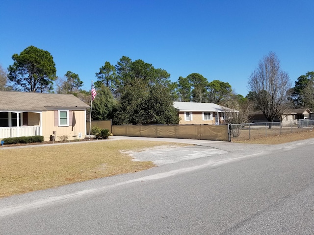 ranch-style house with a front lawn