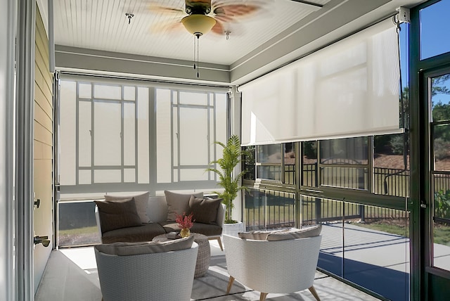 sunroom with ceiling fan and a wealth of natural light