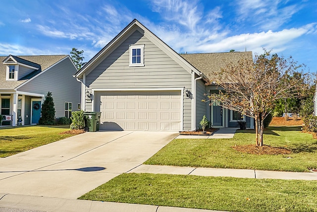 front of property with a garage and a front lawn