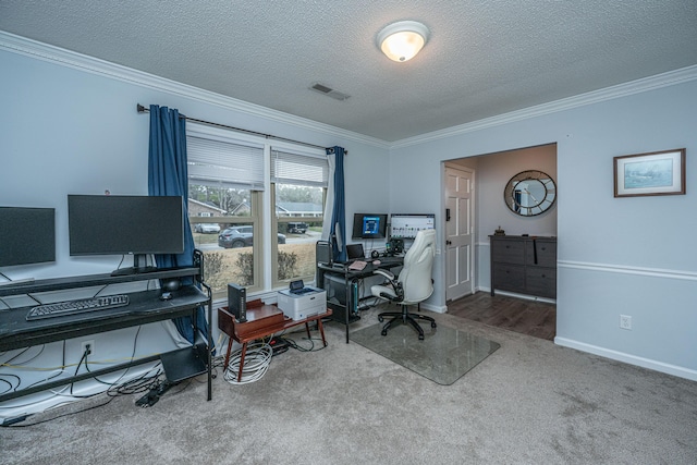 office area featuring ornamental molding, carpet flooring, and a textured ceiling