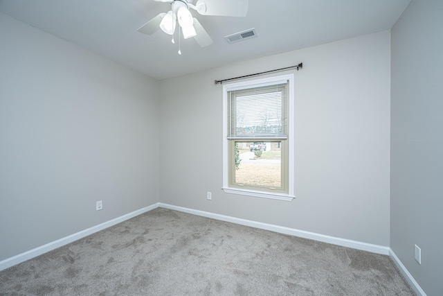 empty room featuring light carpet and ceiling fan