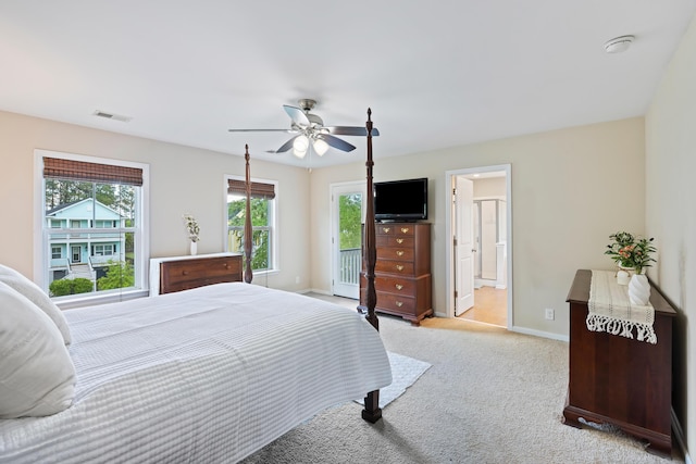 bedroom featuring multiple windows, carpet floors, baseboards, and ceiling fan