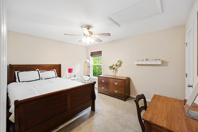 bedroom featuring attic access, light carpet, ceiling fan, and baseboards