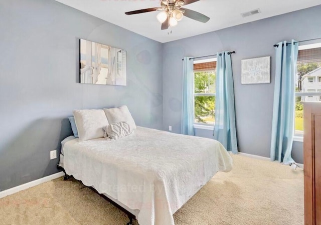 bedroom with carpet floors, baseboards, and ceiling fan