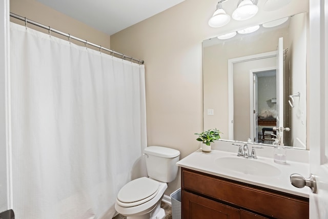 full bath featuring toilet and vanity