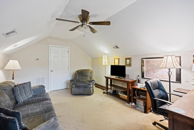 carpeted office space featuring vaulted ceiling and a ceiling fan