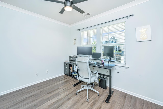 office space featuring visible vents, a ceiling fan, baseboards, and wood finished floors