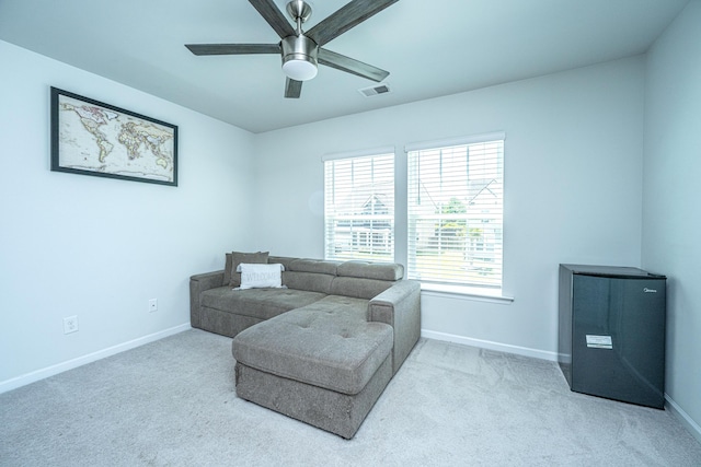 sitting room with baseboards, carpet floors, and visible vents