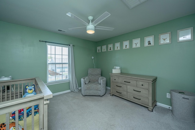 carpeted bedroom featuring baseboards, visible vents, and ceiling fan