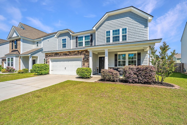 view of front facade featuring covered porch, driveway, a front yard, a garage, and fence
