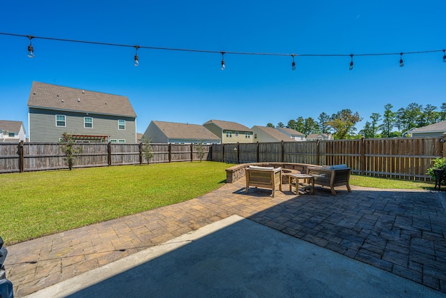 view of patio with a fenced backyard, an outdoor living space, and a residential view