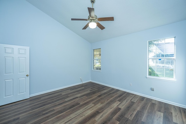 spare room with lofted ceiling, dark hardwood / wood-style floors, and ceiling fan