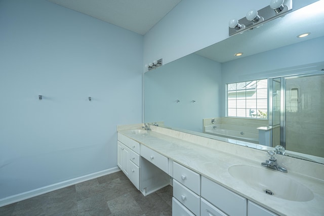 bathroom featuring vanity and plus walk in shower